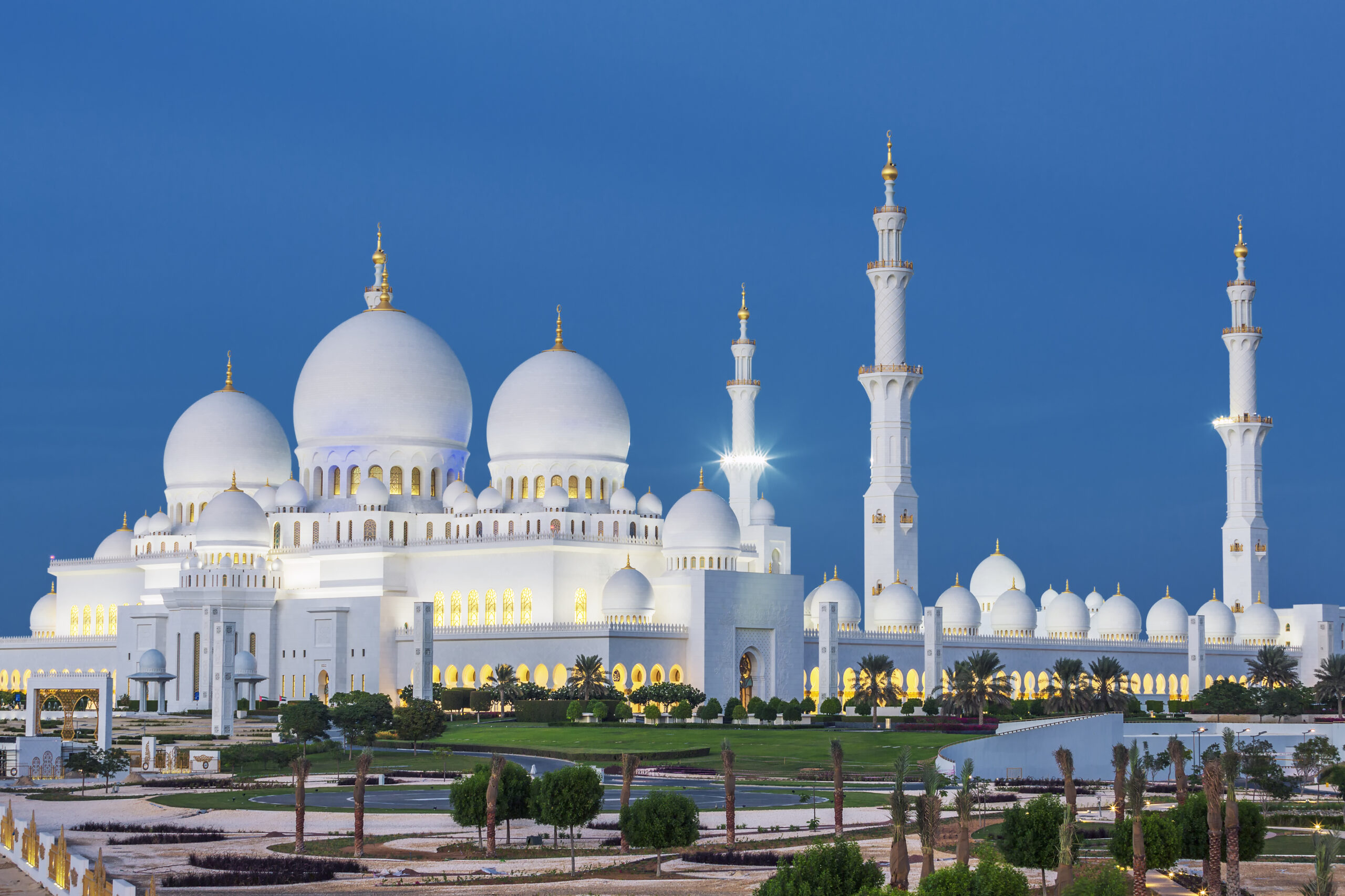 View of famous Abu Dhabi Sheikh Zayed Mosque by night, UAE.